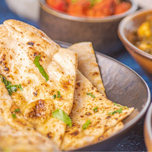 Load image into Gallery viewer, A stack of crispy Naans