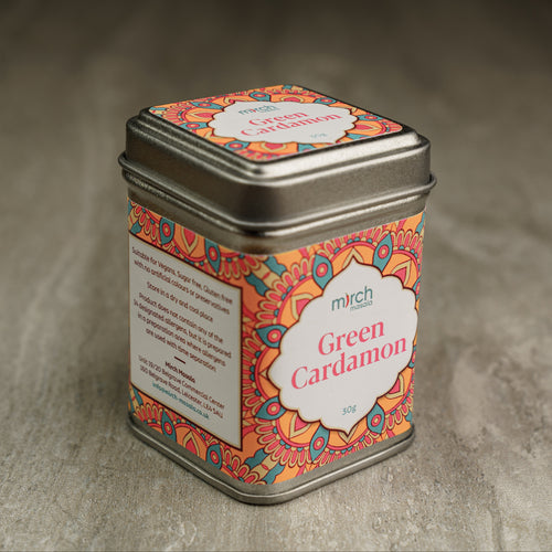A tin of Green Cardamon seeds spice blends